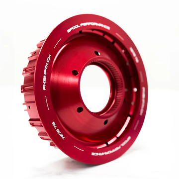 Red anodized billet aluminum automotive clutch basket, performance car part on white background
