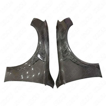 Carbon fiber car fender flares set for Audi, with vent detailing, on white background.