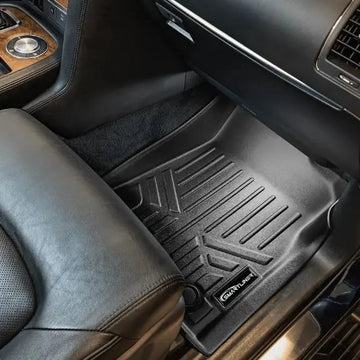 Custom-fit black Smartliner floor mat in luxury car front passenger footwell