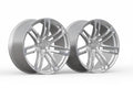 Pair of silver multi-spoke alloy wheels for Audi performance cars on white background