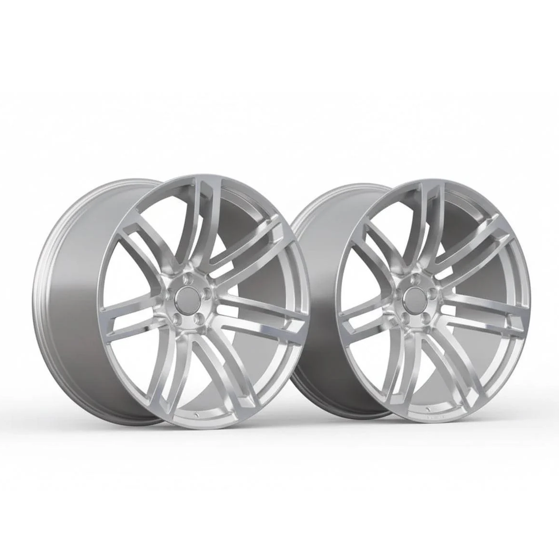 Pair of silver alloy Audi performance wheels with multi-spoke design on white background
