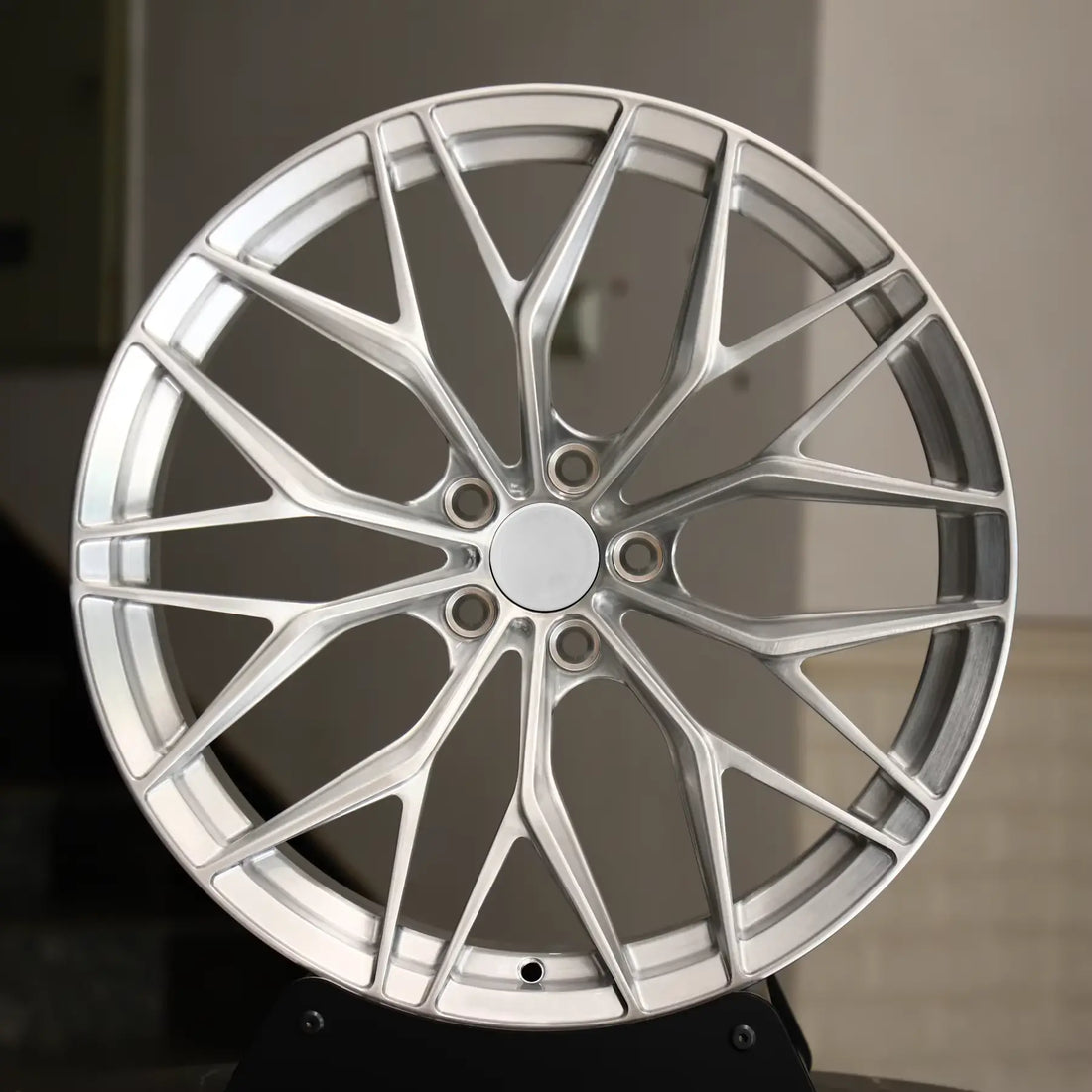 Silver multi-spoke alloy wheel for Audi performance upgrade, modern and lightweight design