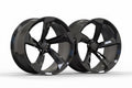 Gloss black five-spoke alloy wheels for Audi performance cars on white background