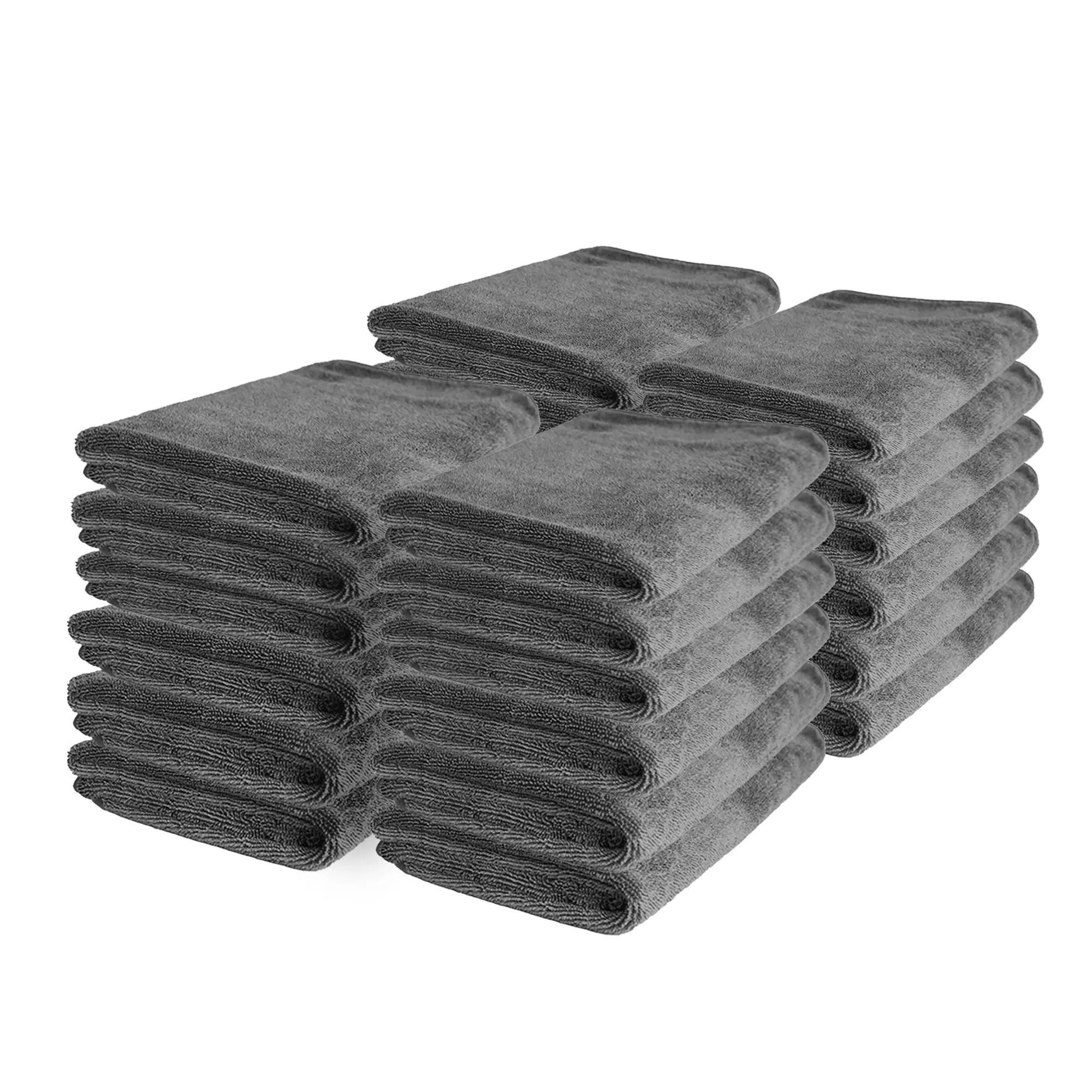 Stack of 24 folded grey microfiber towels for car detailing and cleaning