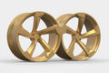Pair of gold alloy 5-spoke Audi performance wheels on white background