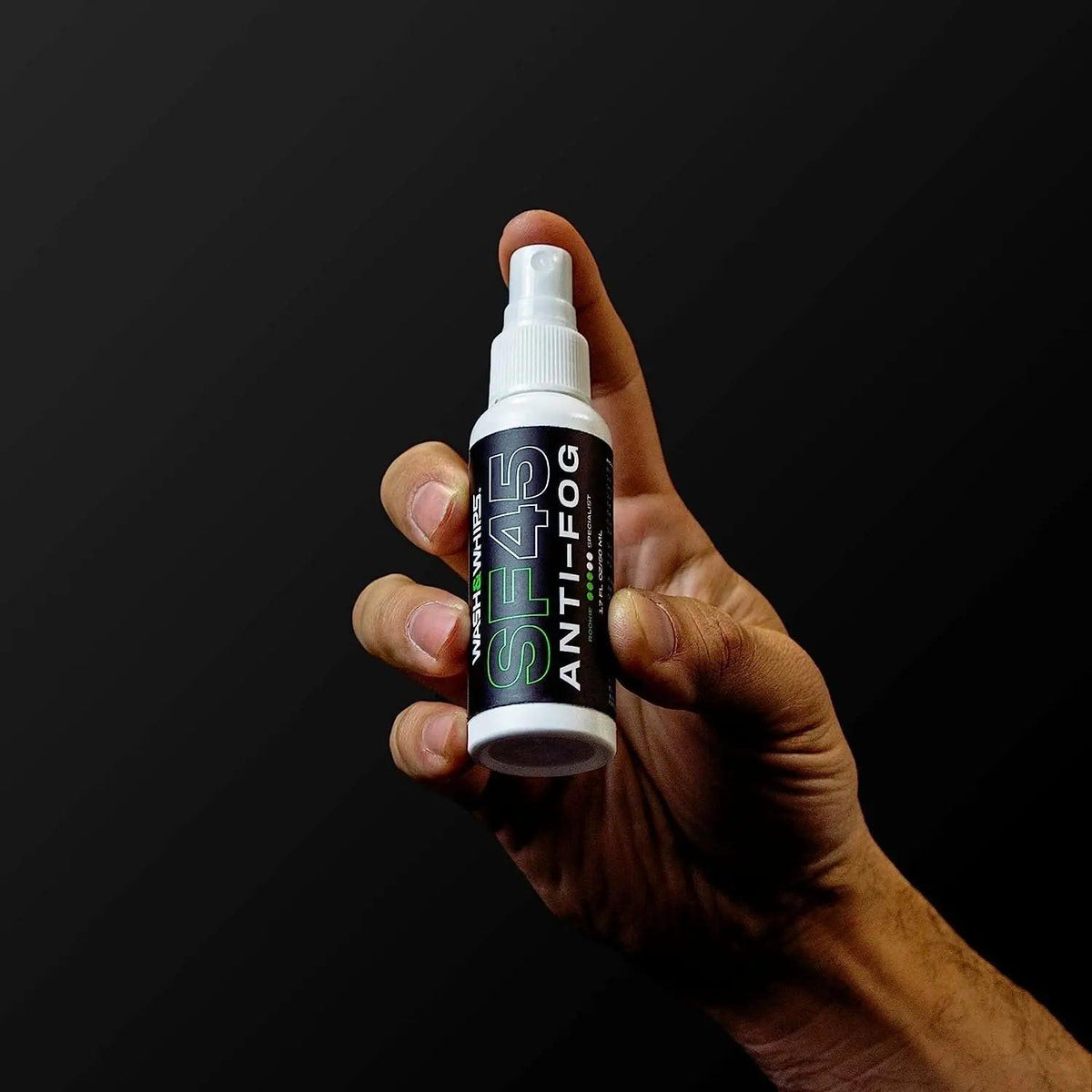 WASH & WHIPS SF45 anti-fog spray for car windshields, clear windshield with no fog or haze, in a spray bottle.