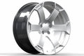 Silver alloy performance wheel rim with a modern split spoke design on white background