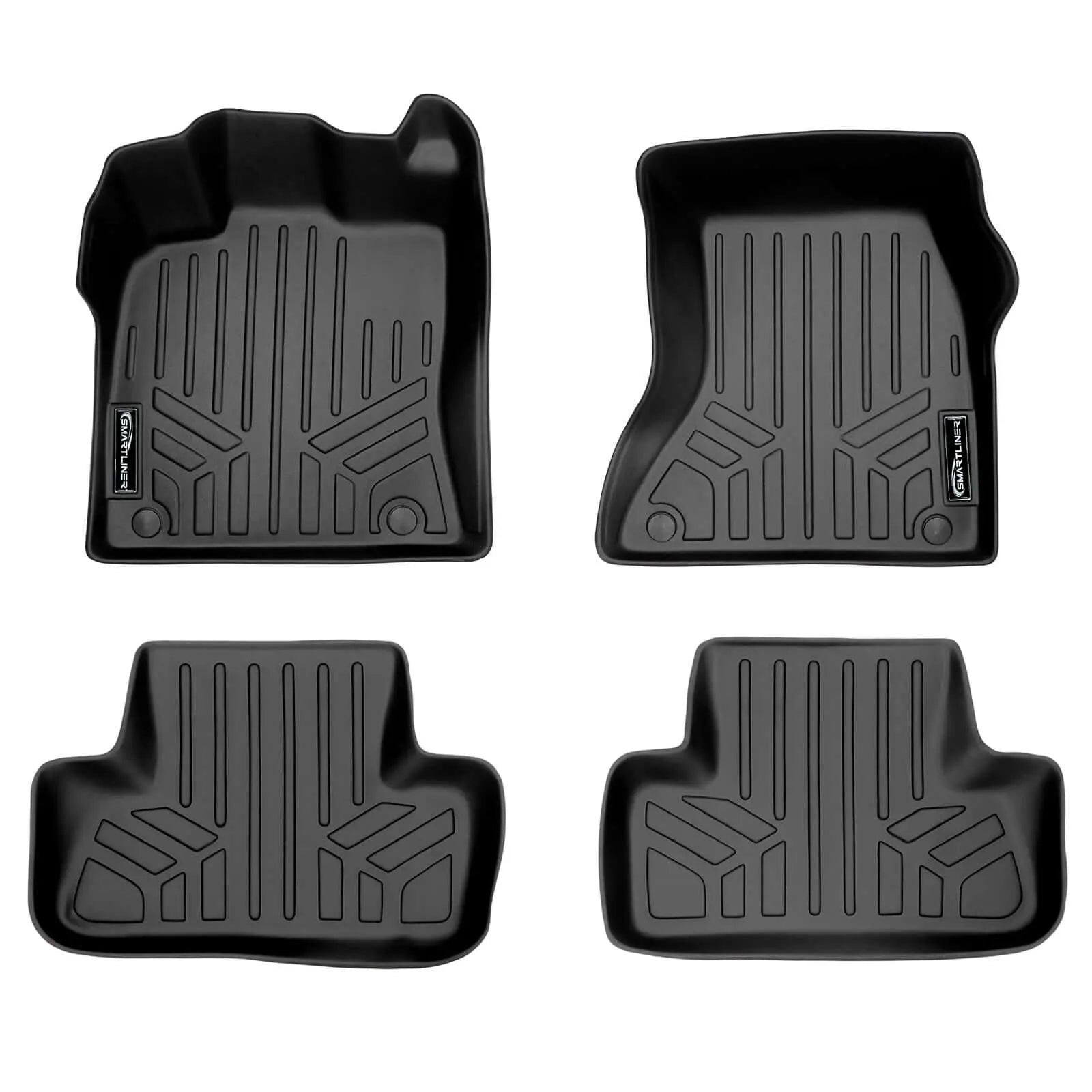 Set of four black all-weather custom fit Audi floor mats with raised edges and textured design