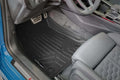 Audi driver footwell with black custom Smartliner floor mat, sporty pedals and leather seat