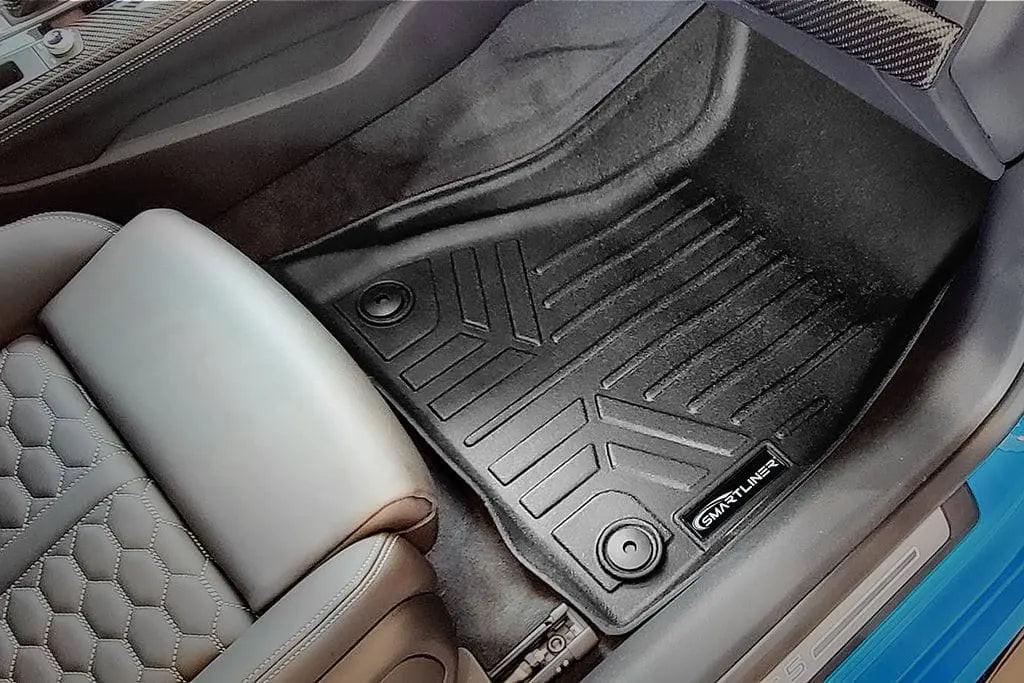 Audi interior with custom fit Smartliner black floor mat and leather seat