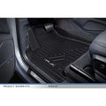 Custom-fit black floor mat installed in Audi Q7 driver's side footwell, close-up view