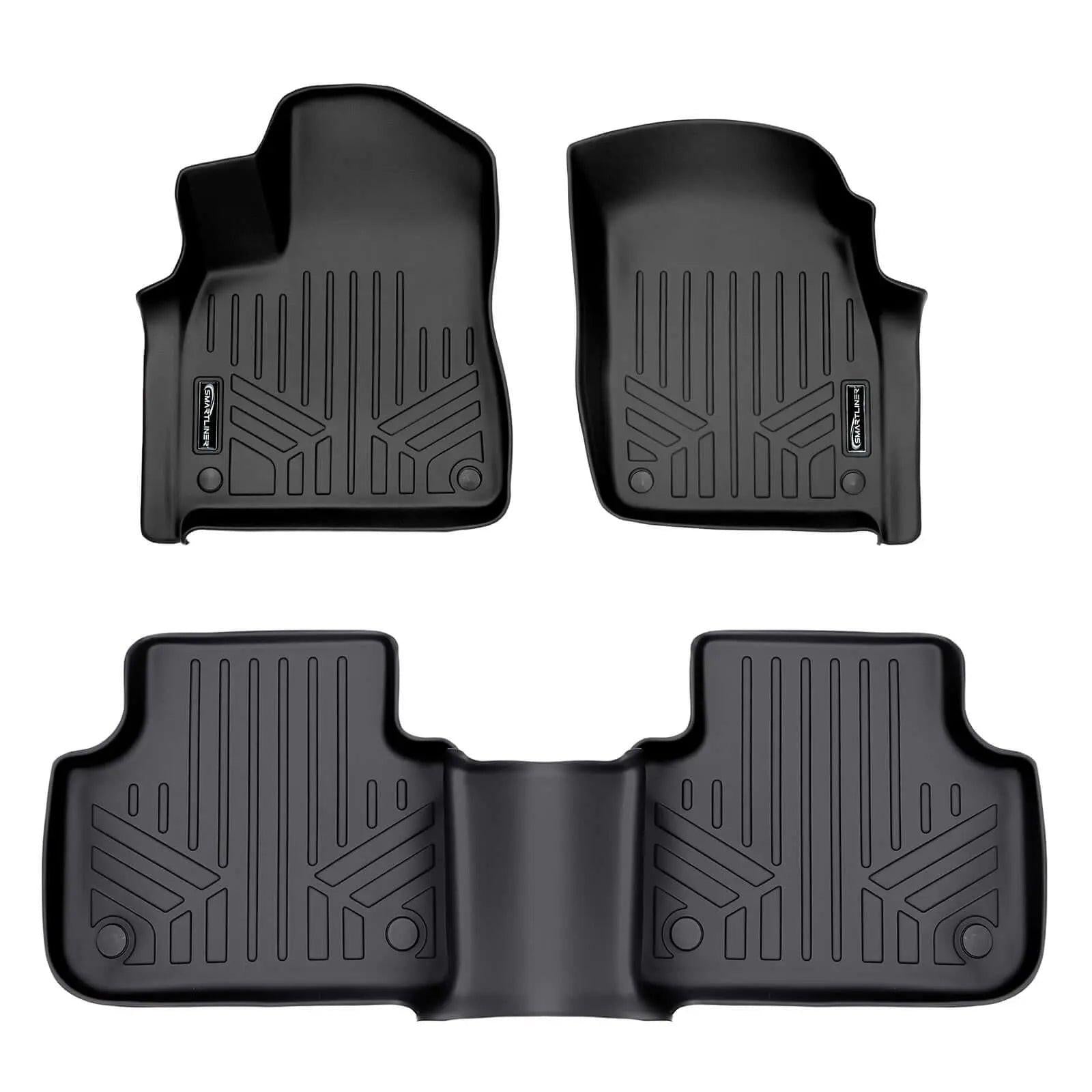 Black custom Audi floor mats set with raised edges and textured grooves, front and rear.