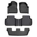 Black custom-fit Audi floor mats set with raised edges and textured pattern, top view.
