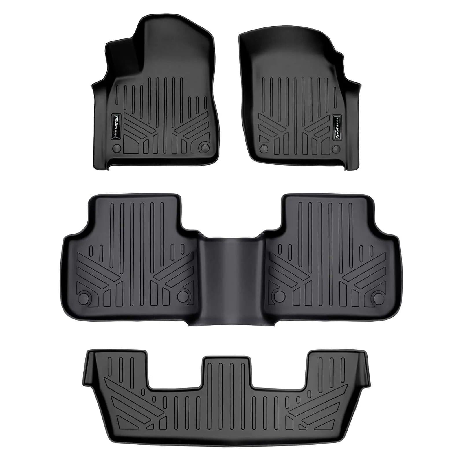 Black custom-fit Audi floor mats set with raised edges and textured pattern, top view.