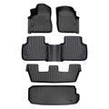 Full set of custom black rubber Audi floor mats, all-weather car interior protection.