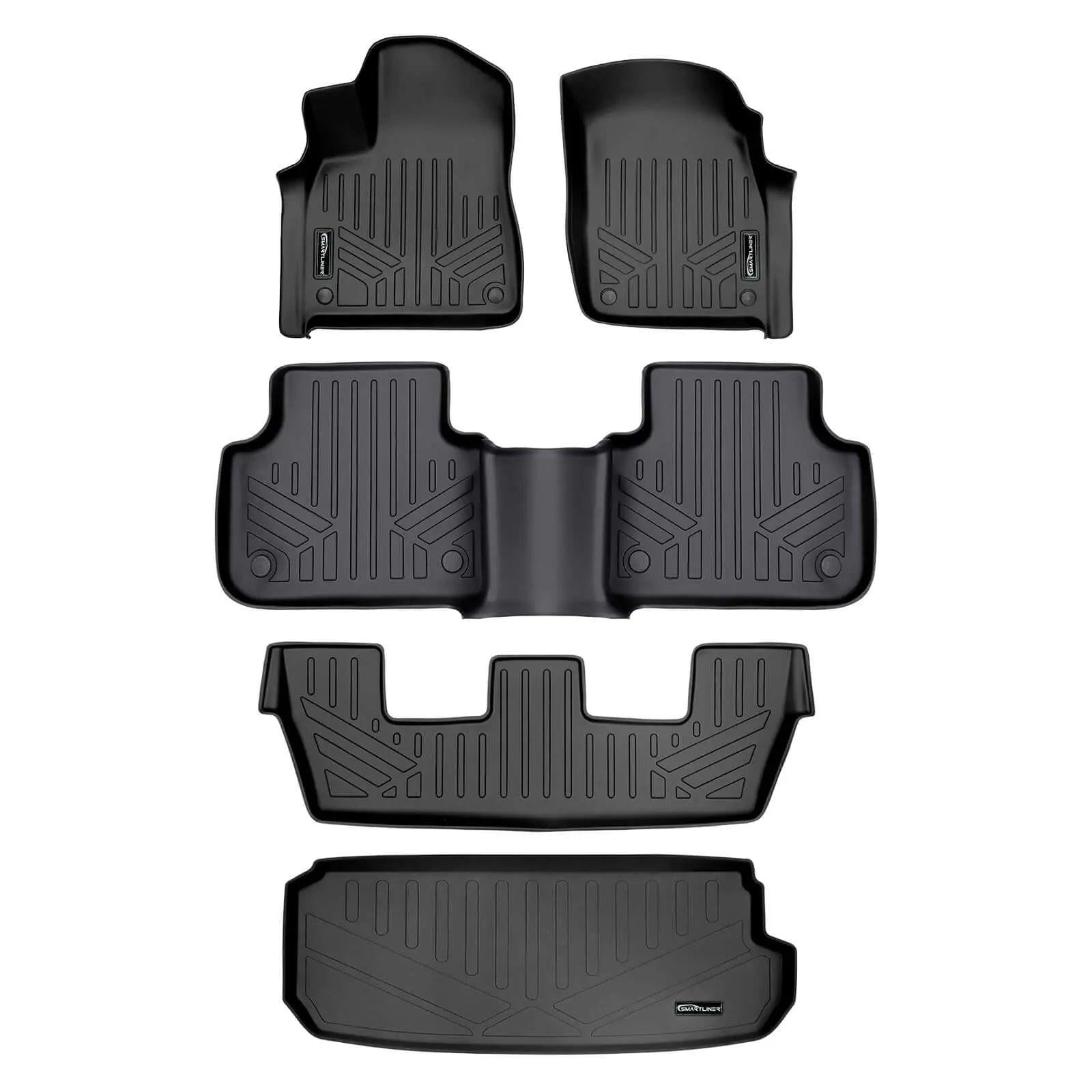 Full set of custom black rubber Audi floor mats, all-weather car interior protection.