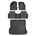 Black Audi all-weather floor mats and cargo liner set with textured surface