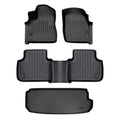 Set of custom-fit black Audi floor mats with textured grooves for all-weather protection