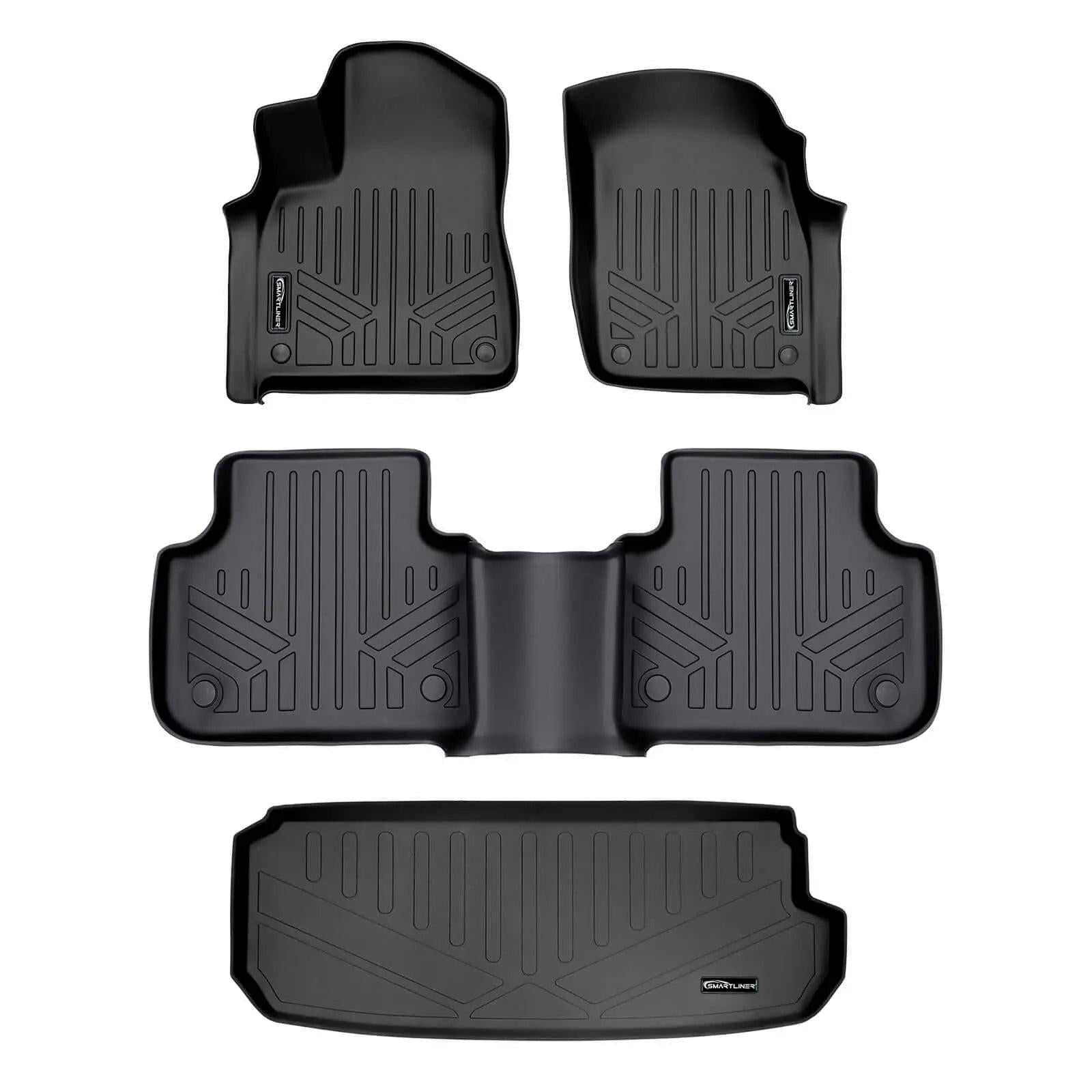 Set of custom-fit black Audi floor mats with textured grooves for all-weather protection