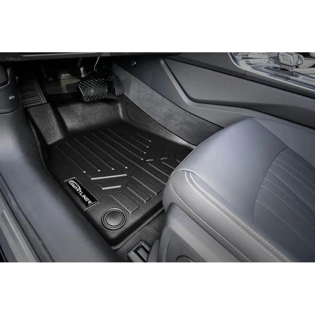 Audi interior with custom Smartliner floor mat, black all-weather protection, front seat view