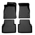Set of four black custom-fit rubber car floor mats with raised edges and textured pattern