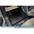 Custom black floor mat installed in Audi E-Tron driver's side footwell interior