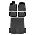 Full set of custom-fit black rubber Audi floor mats and cargo liner on white background