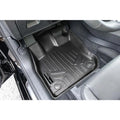Audi driver side floor mat liner installed, all-weather black custom fit, textured surface