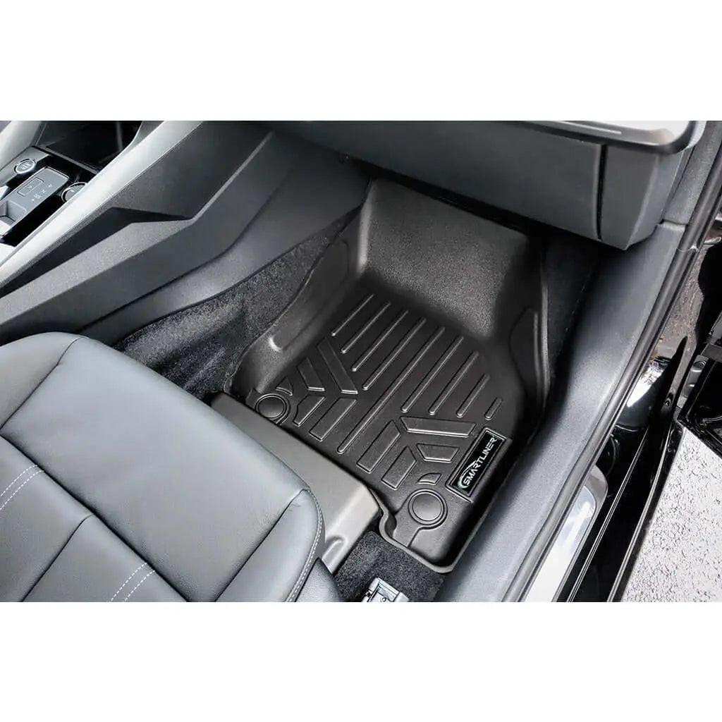Audi interior with custom fit black floor mat and leather seat, passenger side view