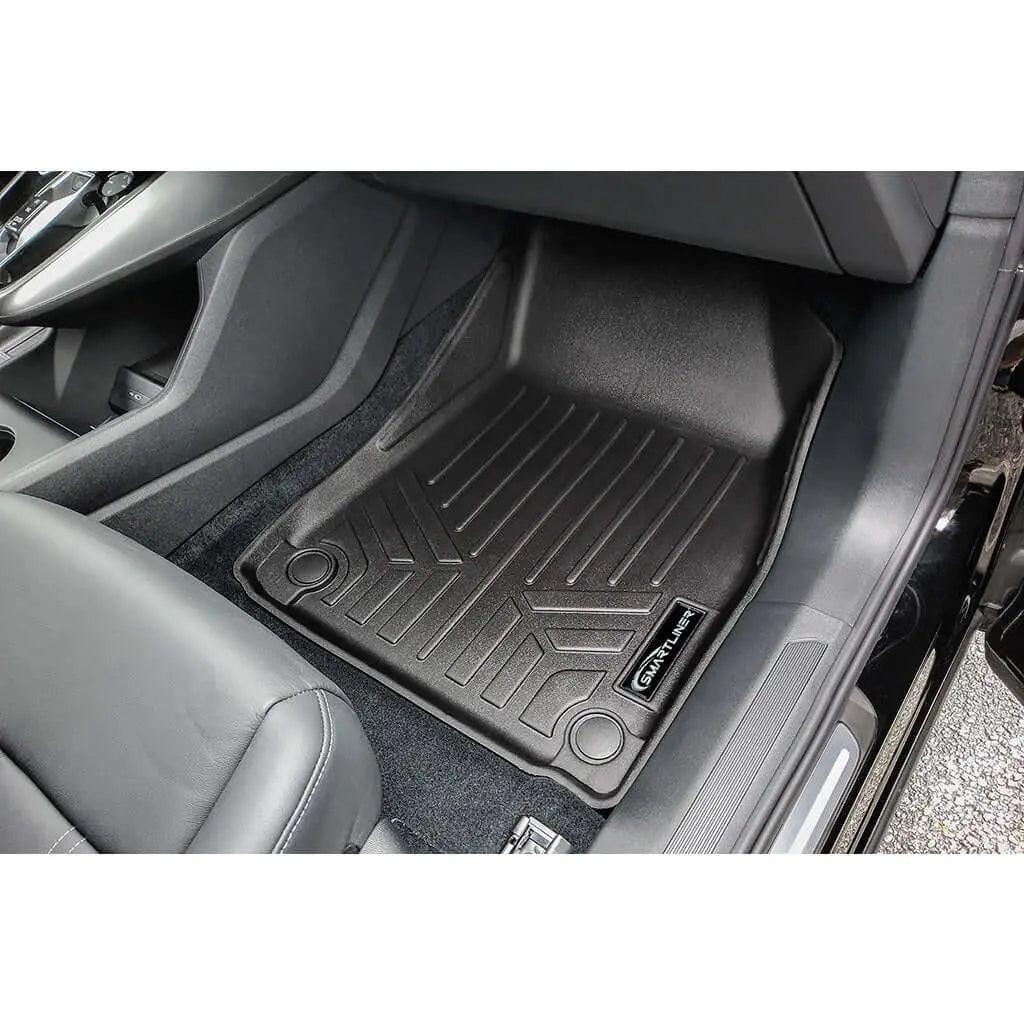 Custom-fit black rubber car floor mat for Audi front passenger seat interior.