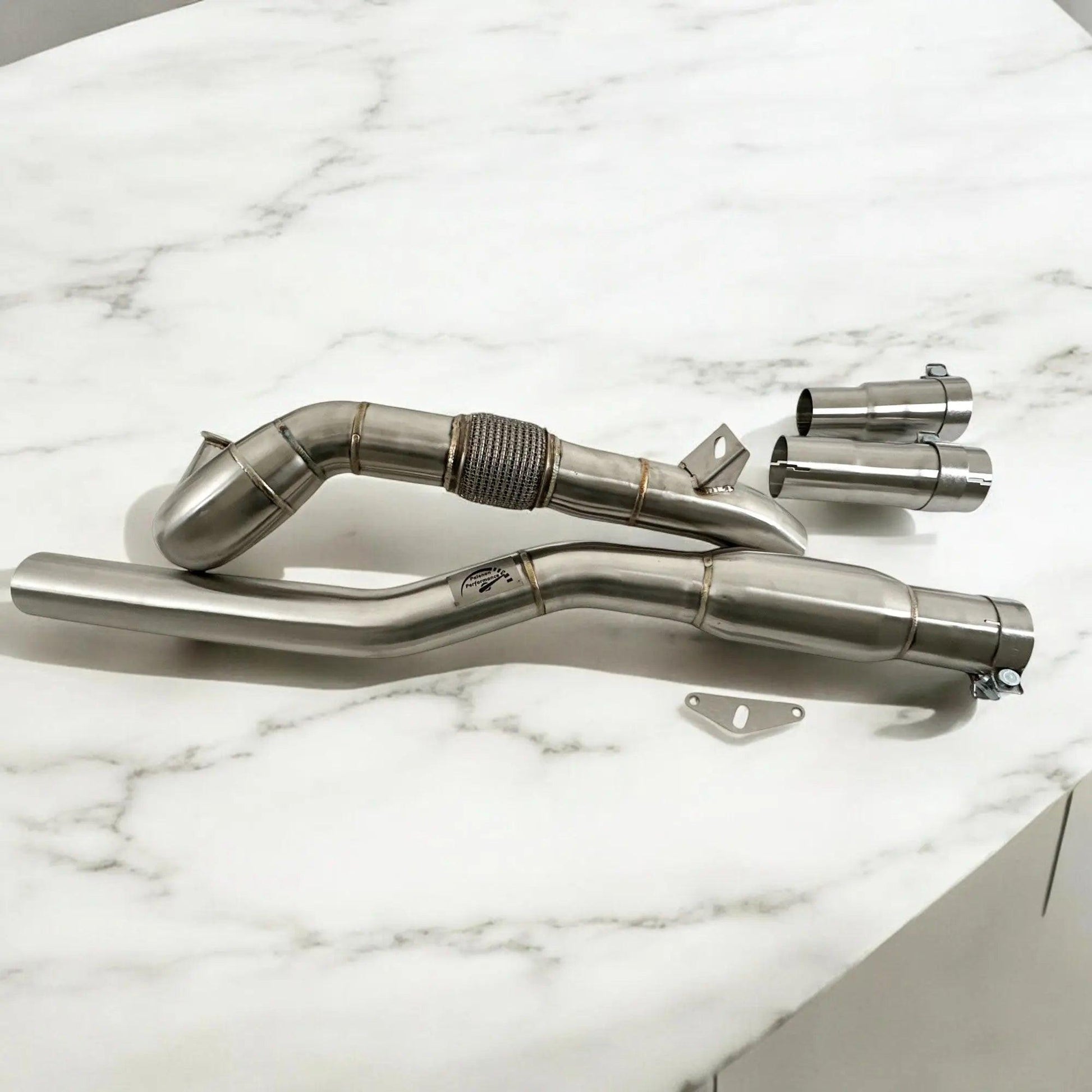 Stainless steel Audi A3 S3 AWD downpipe exhaust kit on white marble surface