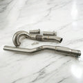 Stainless steel downpipe kit for Audi A3 S3 AWD displayed on white marble surface