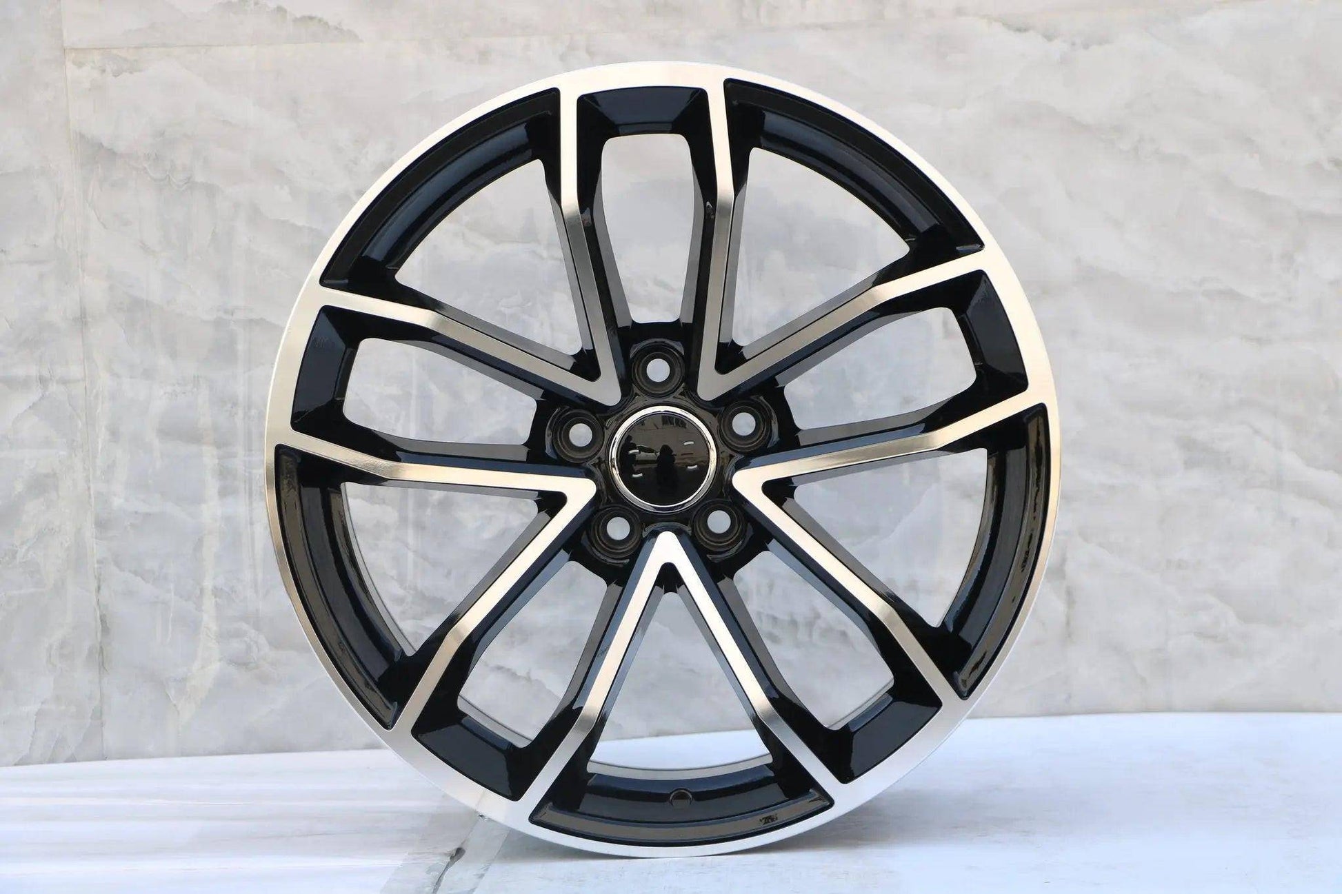 Black machined face 18-inch Audi S5 WheeloutletNJ wheels fitted on Audi S5, showcasing sleek design and sporty style.