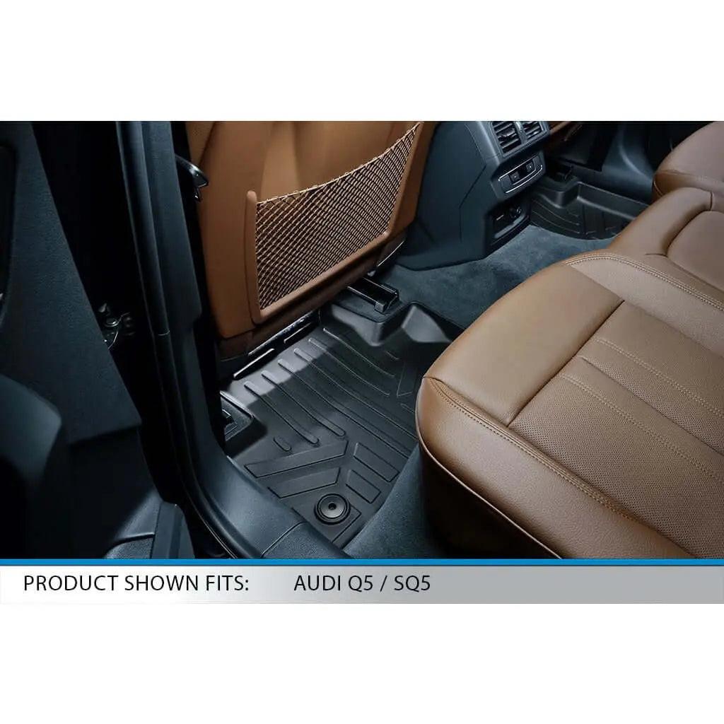 Custom-fit black floor mat in the rear seat of an Audi Q5 or SQ5 with brown leather seats