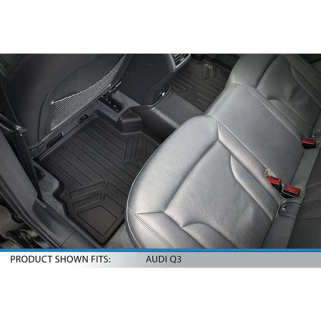 Custom black floor mats installed in rear seat of Audi Q3 with leather seats.