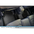 Custom black floor mats installed in the rear seating area of an Audi Q3