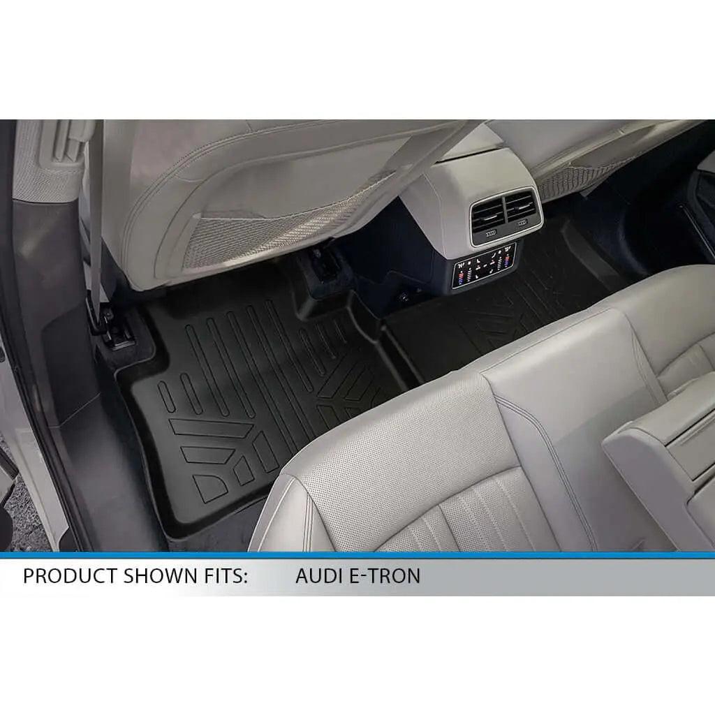 Custom rear floor mats installed in Audi E-Tron interior, black all-weather liner shown.