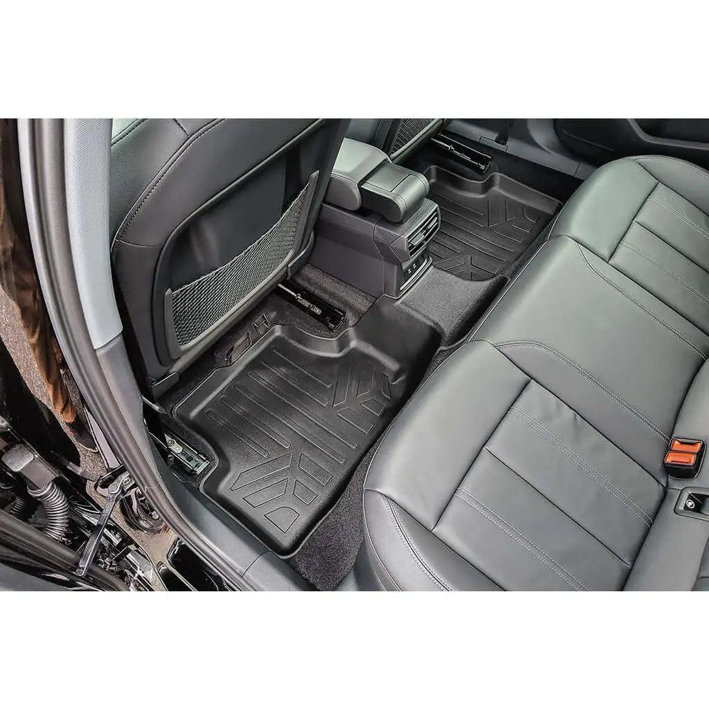 Audi rear seat with custom-fit all-weather floor mats and black leather interior