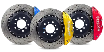 Three high-performance drilled brake rotors with blue, yellow, and red calipers