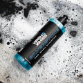 Wash & Whips Silverstone car wash shampoo bottle on soapy surface