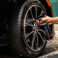 WASH & WHIPS Wheel and Tire Wash & Shine Kit with cleaning brushes and products for vehicle wheel detailing.