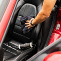 WASH&WHIPS interior car wash kit step 2 with cleaning brushes and cloths for detailed vehicle cleaning.