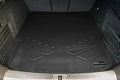 Black custom-fit cargo trunk mat liner installed in car boot, embossed SMARTLINER logo visible