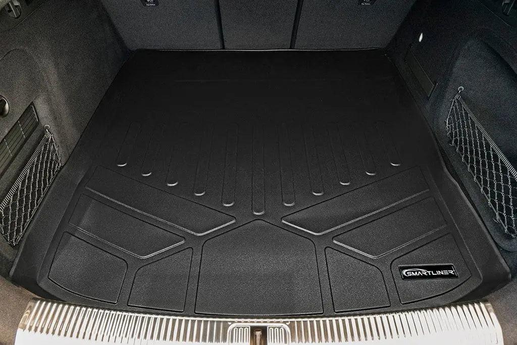 Custom-fit black trunk cargo liner mat in Audi SUV with Smartliner badge, protective design