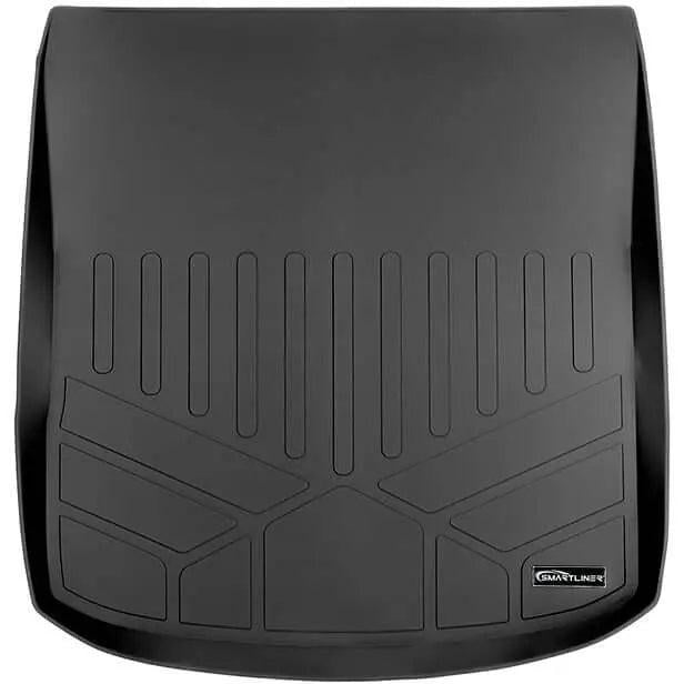 Black custom-fit Audi trunk mat with raised edges and geometric texture for cargo protection