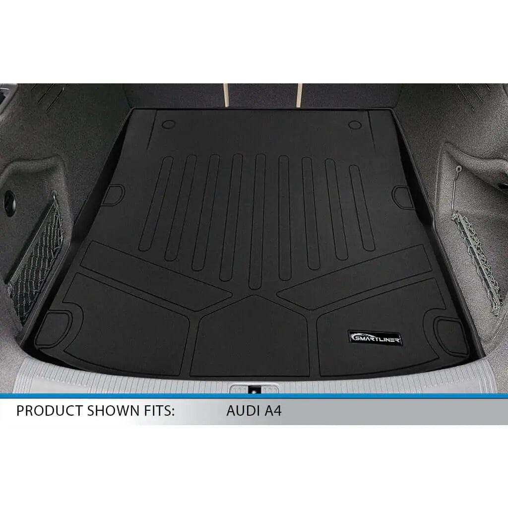 Black Smartliner trunk mat installed in Audi A4 cargo area, showing custom fit and raised edges.
