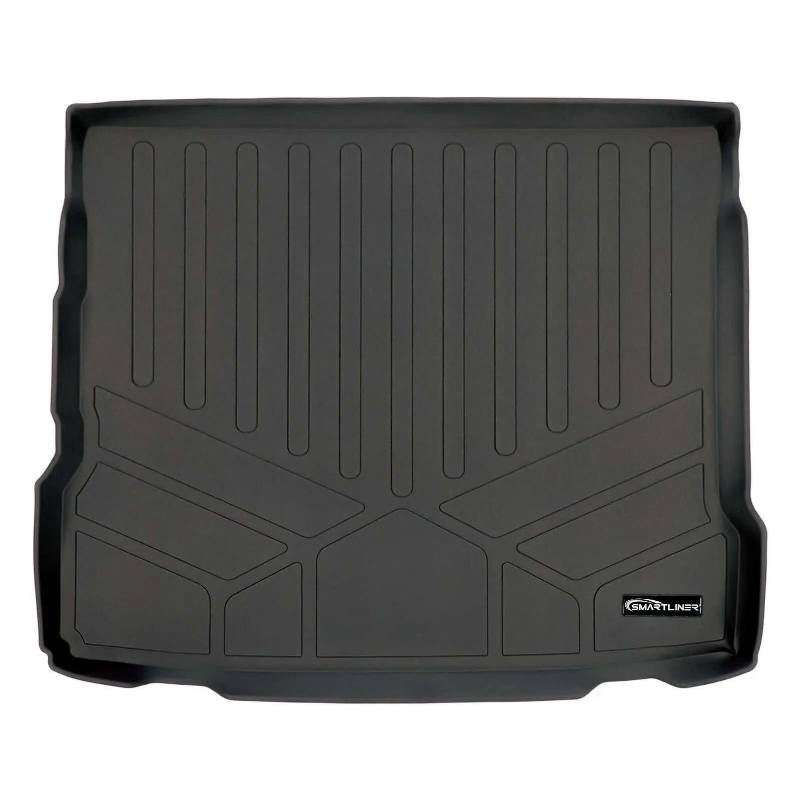 Black custom-fit trunk cargo liner with raised edges and geometric pattern
