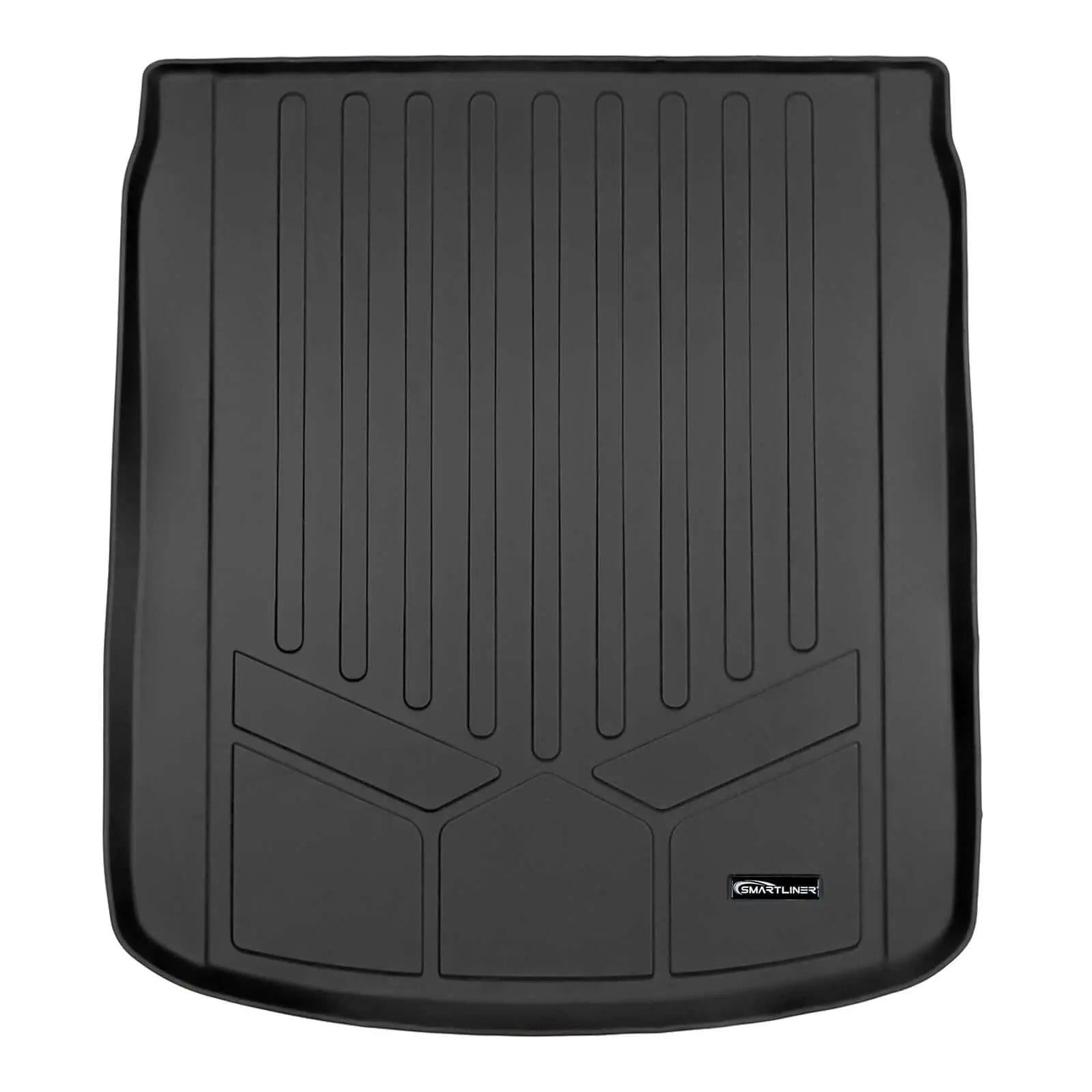 Black custom-fit rubber cargo trunk liner with raised edges and textured grooves for Audi