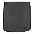 Black custom-fit rubber cargo trunk liner with raised edges and textured grooves