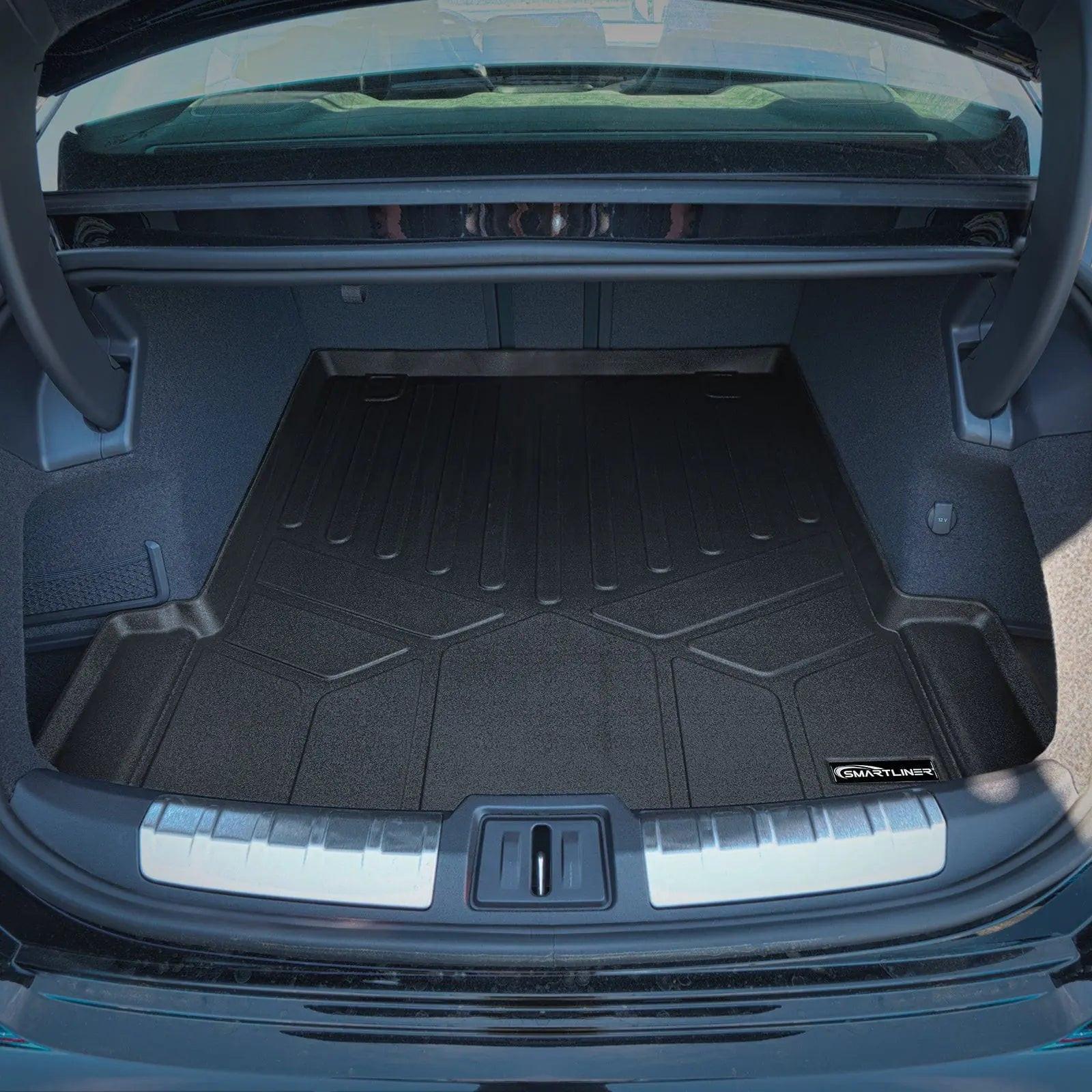 Audi trunk with custom-fit black cargo liner and protective mat